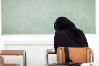 rear view of Arabian school girl in classroom