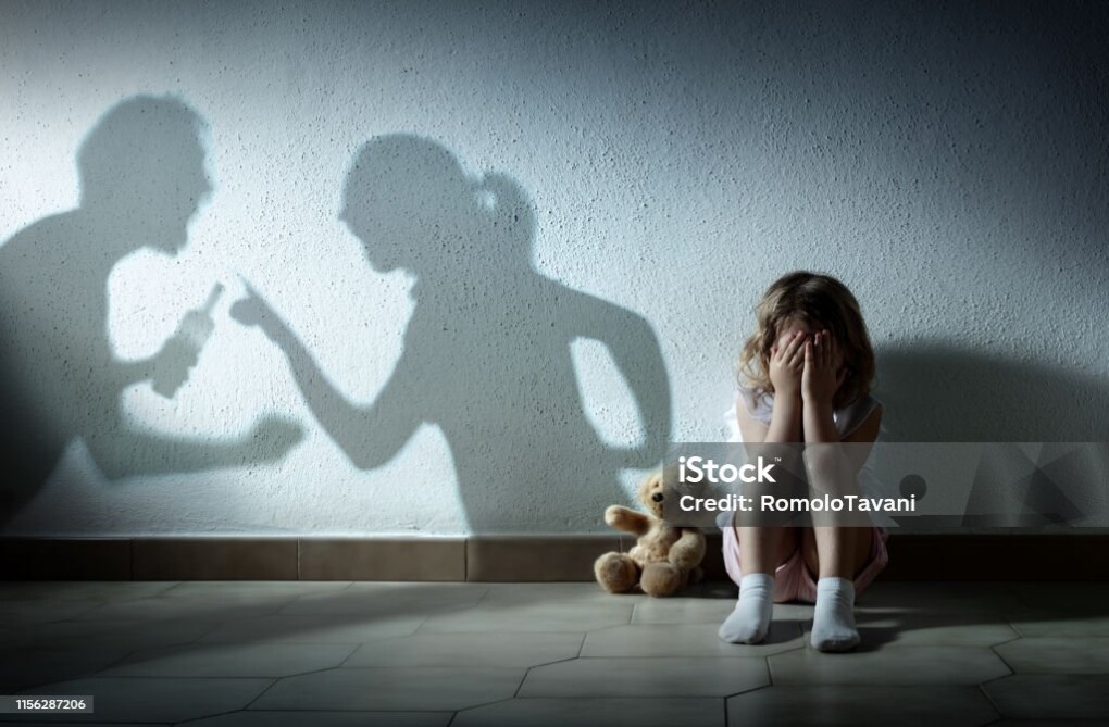 Little Girl Crying With Shadow Of Parents Arguing - Home Violence And Divorce