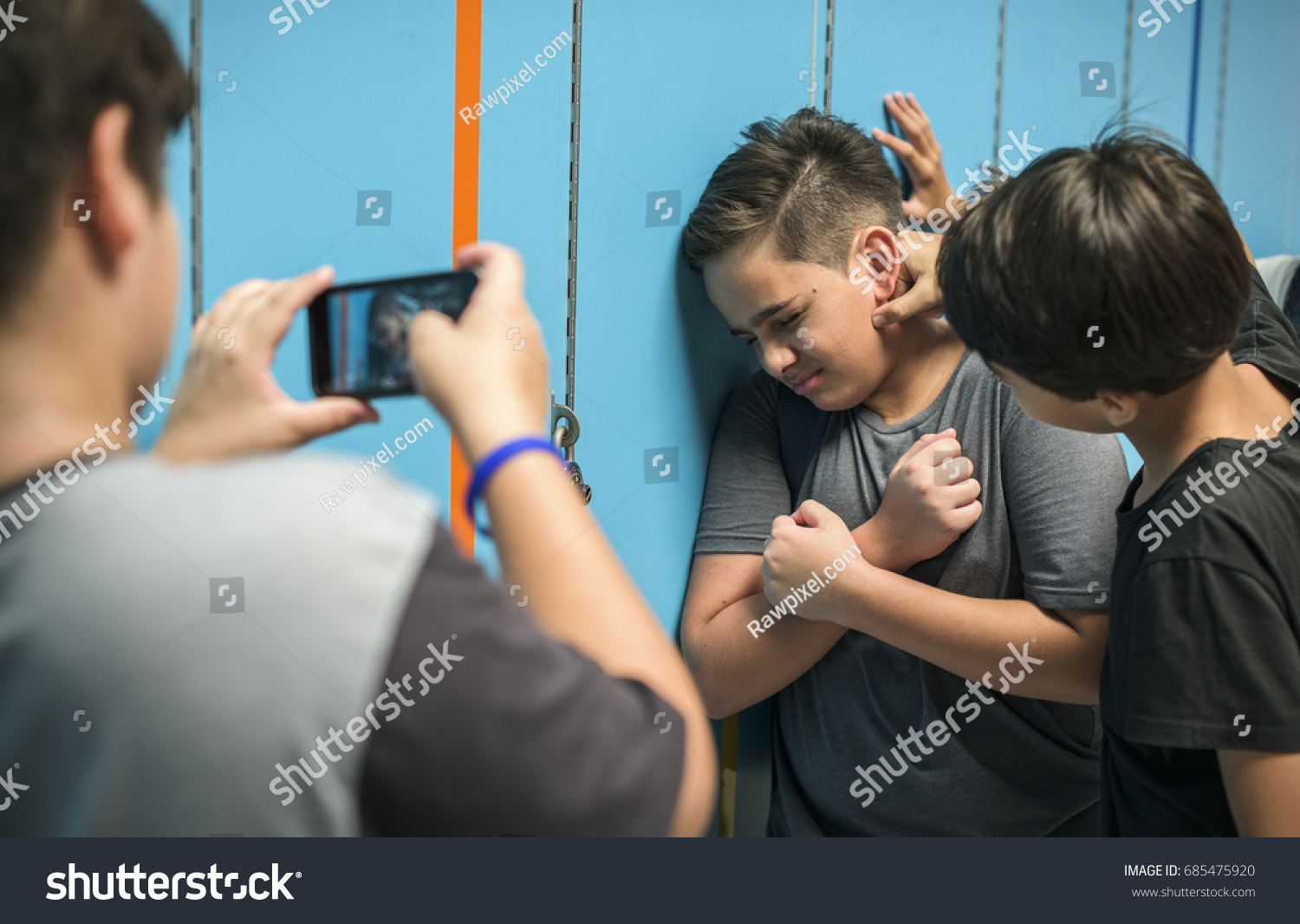 stock-photo-young-student-torturing-of-school-bullying-685475920
