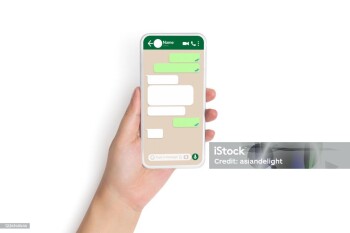 closeup hand holding smart phone with social network mock up blank speech bubbles template chat box dialogue on phone screen for text chatting and online message concept, isolated on white background