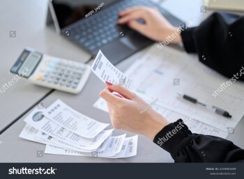 stock-photo-asian-woman-entering-expenses-in-accounting-software-2259901609
