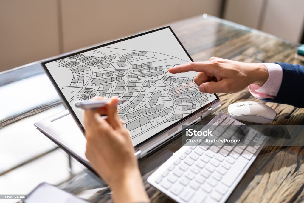 Cadastre Map And City Building Survey On Laptop