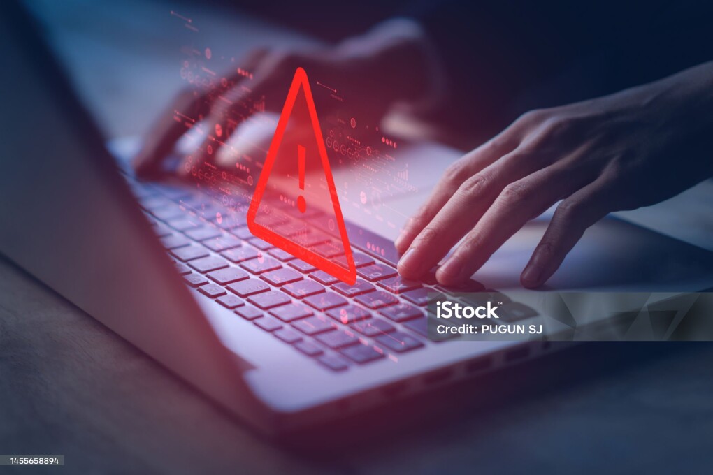 System hacked warning alert on notebook (Laptop). Cyber attack on computer network, Virus, Spyware, Malware or Malicious software. Cyber security and cybercrime. Compromised information internet.