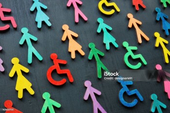 Colorful figurines on the dark surface. Diversity and inclusion concept.