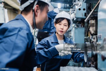 Foreign workers being taught how to work at the factory