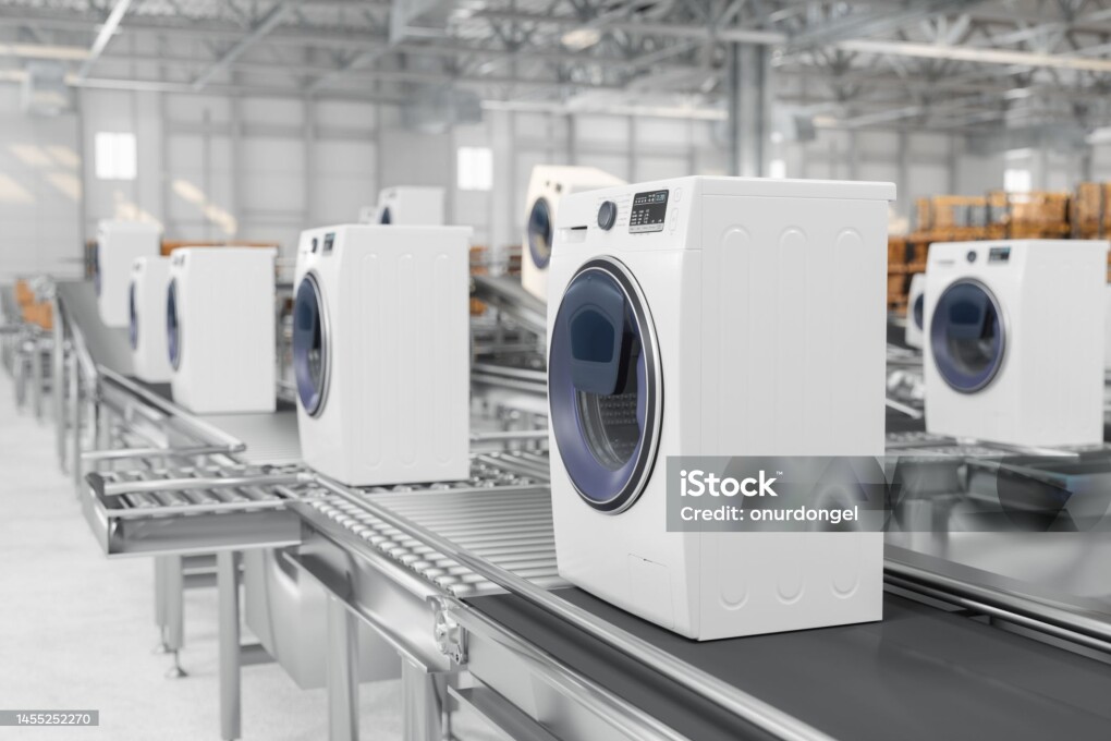 Close-up View Of Washing Machines On Conveyor Belt In Warehouse