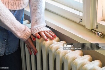 Old heavy duty radiator heats the room in best way