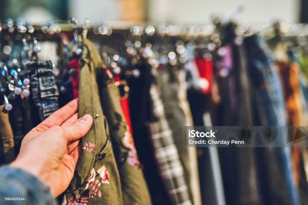 Cropped shot of a woman shopping for clothes at a second hand store