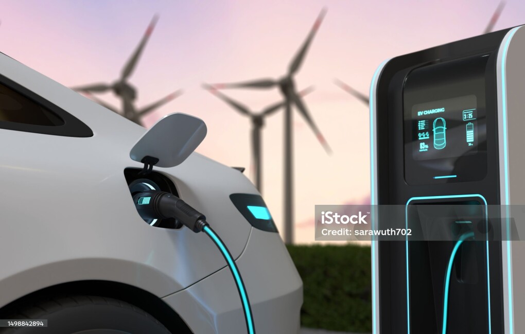 Electric cars Charging at the charging station and with a Wind turbine background, Electric power is an alternative fuel. 3D illustration