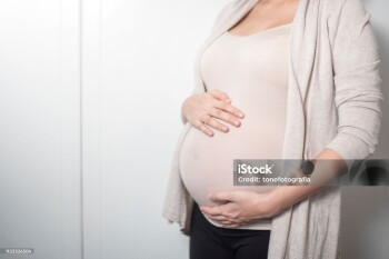 Close up pregnant woman expecting a baby