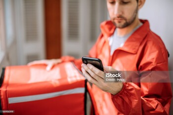 Food delivery man getting ready for work