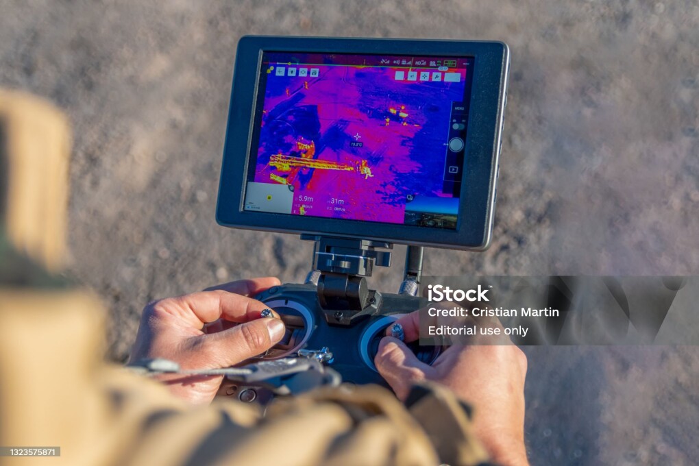 San Rafael, Argentina, June 12, 2021: firefighter flying drone with thermal camera