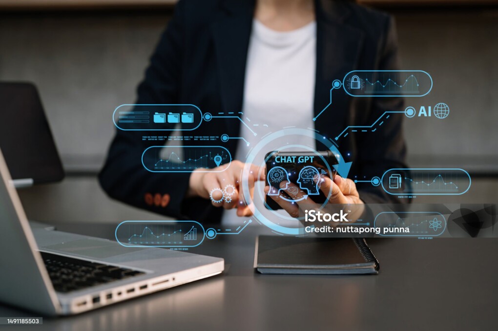 Woman using chatbot in computer and tablet smart intelligence Ai.A.I. Chat with AI Artificial Intelligence, developed by OpenAI generate. Futuristic technology, robot in online system. in office