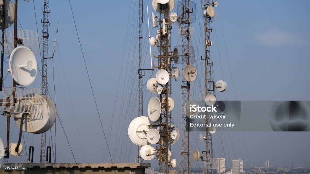 Telecommunication antenna towers on top of multi-storey buildings for digital mobile network. Bekasi, 25 August 2024.
