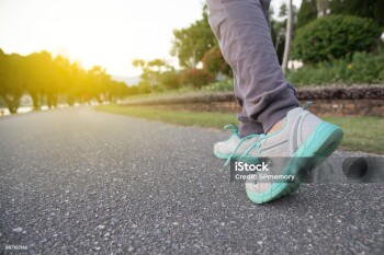 Road to success,running on road with sports shoes,healthy lifestyle sports woman running, female legs with sneakers jogging in evening prepare for marathon