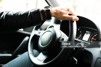 Close up view of a car steering wheel. Manual gearbox. Car interior details. Car transmission. Soft lighting. Abstract view.