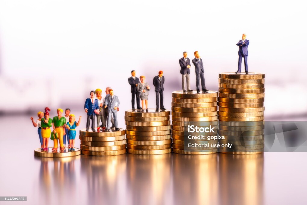 Frankfurt, Hesse, Germany - March 11, 2019: Rising stacks of coins with figures