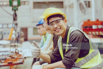 Heavy Industry Worker workman service team working in metal factory Portrait Happy smiling.