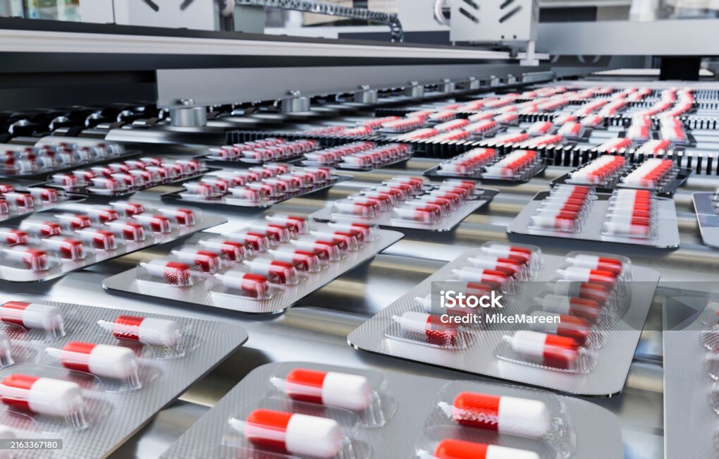 Capsules in blister pack on production line in pharmaceutical industry