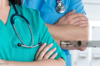 Two doctors standind with their arms crossed on chest ready to work. Healthcare and medical concept.