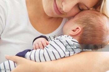 Beautiful mother holding her newborn baby