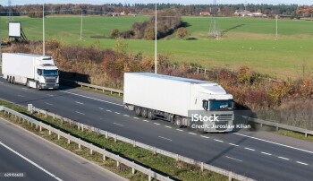 Two lorries in motion on the british motorway