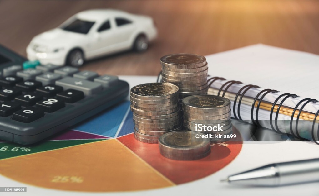 Car insurance and car service. Toy car for accounting and financial concept.