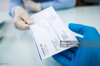Giving Cheque Of Payroll Check To Employee In Gloves