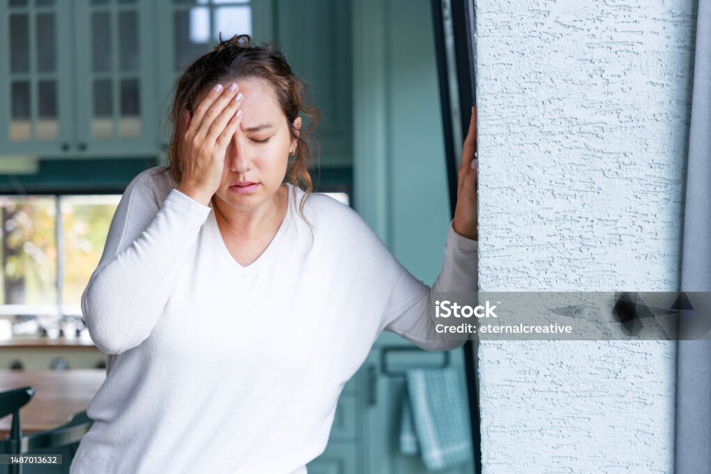 Young woman suffering from vertigo or dizziness problem of brain or inner ear