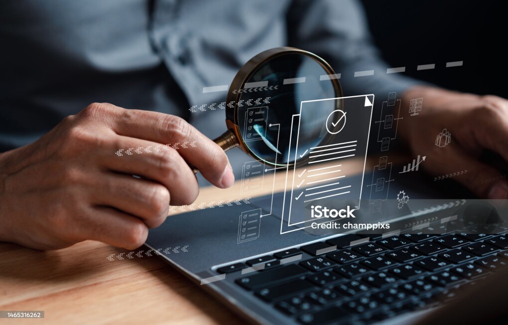 Businessman Inspecting Paperwork Document of Business Data Analysis working Management report with KPI and metrics connected to database. Corporate strategy for finance, operations, sales, marketing.