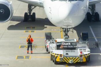 tractor is towing the aircraft