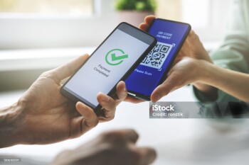 qr code payment - person paying with mobile phone