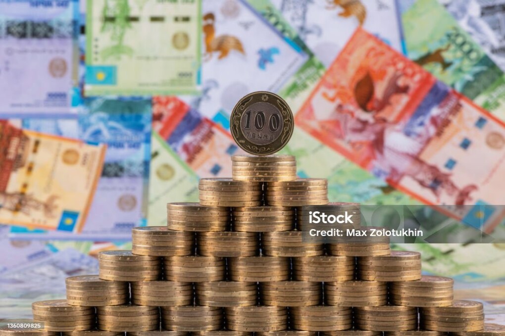 100 Kazakhstani tenge coins stacked in the form of a pyramid
