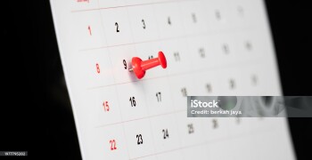 desk calendar with red pin