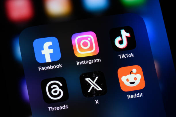 Toronto, Canada - August 22, 2024: Popular social media apps on an Apple iPhone: Facebook, Instagram, TikTok, Threads, X (formerly Twitter), and Reddit.