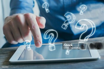 many question marks from the screen of tablet computer, find answer online, FAQ concept, what where when how and why, search information on internet