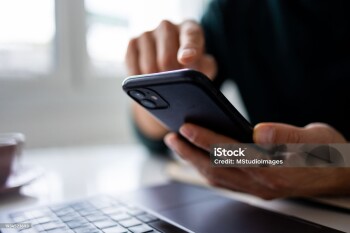 Man using his mobile phone for work