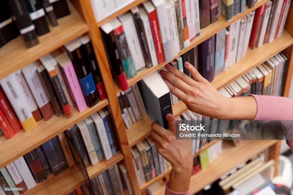 woman in the bookstore selecting books