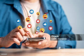 Social media digital content. User interacting with smartphone emoji reactions appear. online engagement, emotional feedback, and digital communication.