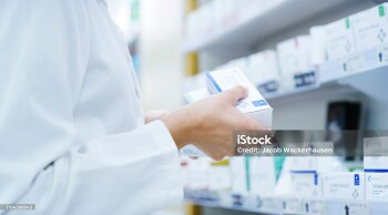 Doctor, hands or shelf with medication at pharmacy for inventory, stock or pharmaceutical service. Closeup, healthcare employee or pharmacist with box or medical product for side effect at drug store