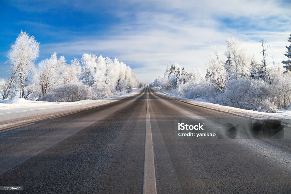 winter landscape with the road and the blue sky