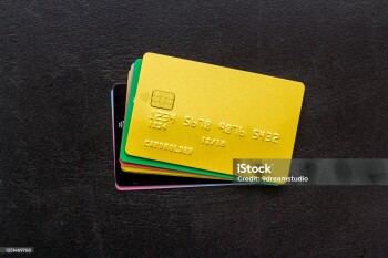 security concept. stack of credit card on black desk top-down.