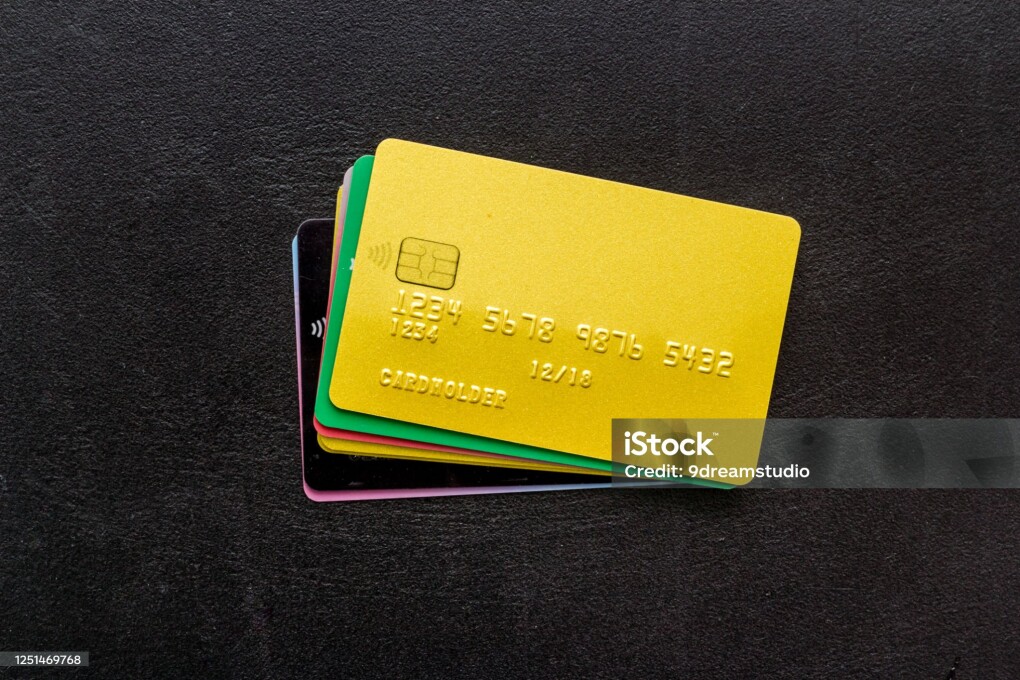 security concept. stack of credit card on black desk top-down.
