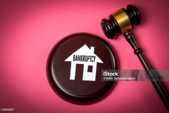 Bankruptcy Legal Concept with House Icon and Judge Gavel on Pink Background.