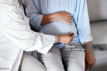 Pregnant, mother stomach and doctor with stethoscope, healthcare and checkup. Pregnancy, female and mama with medical professional, equipment for tummy and appointment for wellness and consulting.