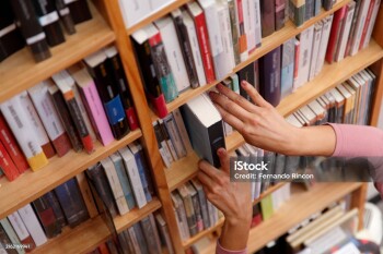 woman in the bookstore selecting books