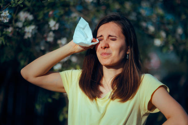 Person with an allergic reaction and vision problems outdoors