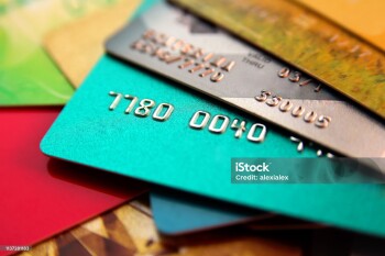 stack of multicolored credit cards, close up view with selective focus