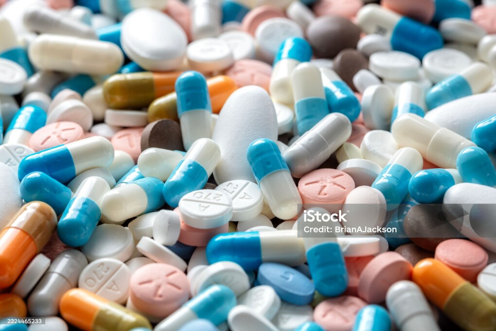 Pills tablets and capsules health care and prescription medicine close up background