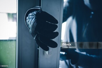 Burglar Breaking Into House